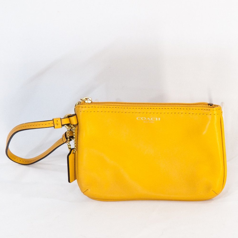 Coach gold or mustard yellow wristlet.
